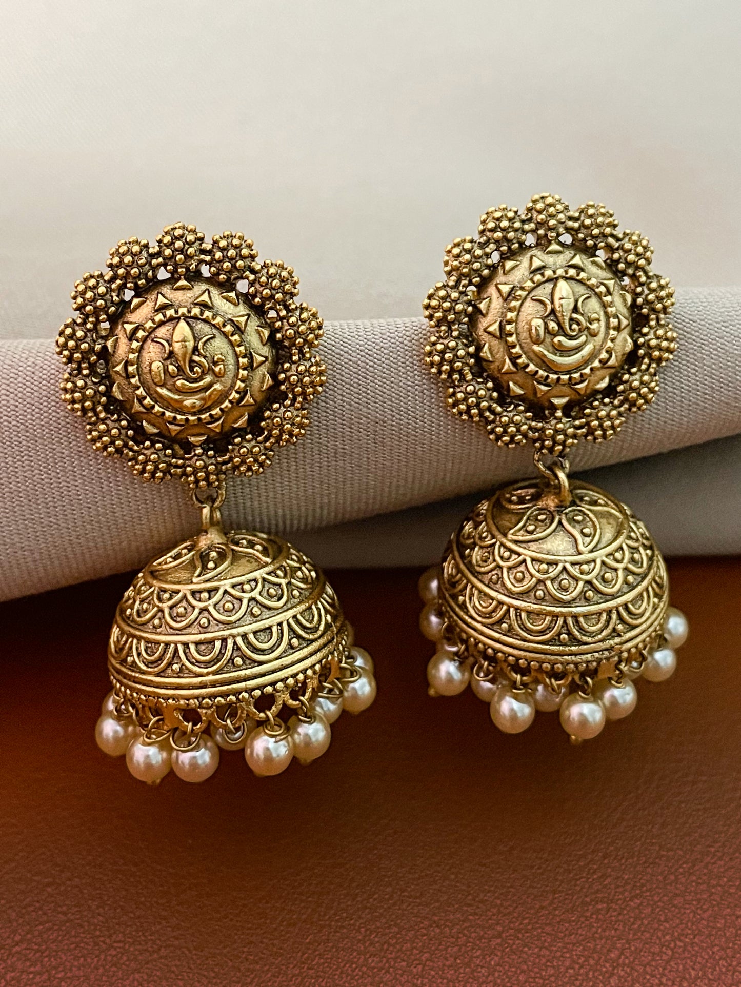 Divyana Ganesha Antique Gold Finish Jhumki Earrings